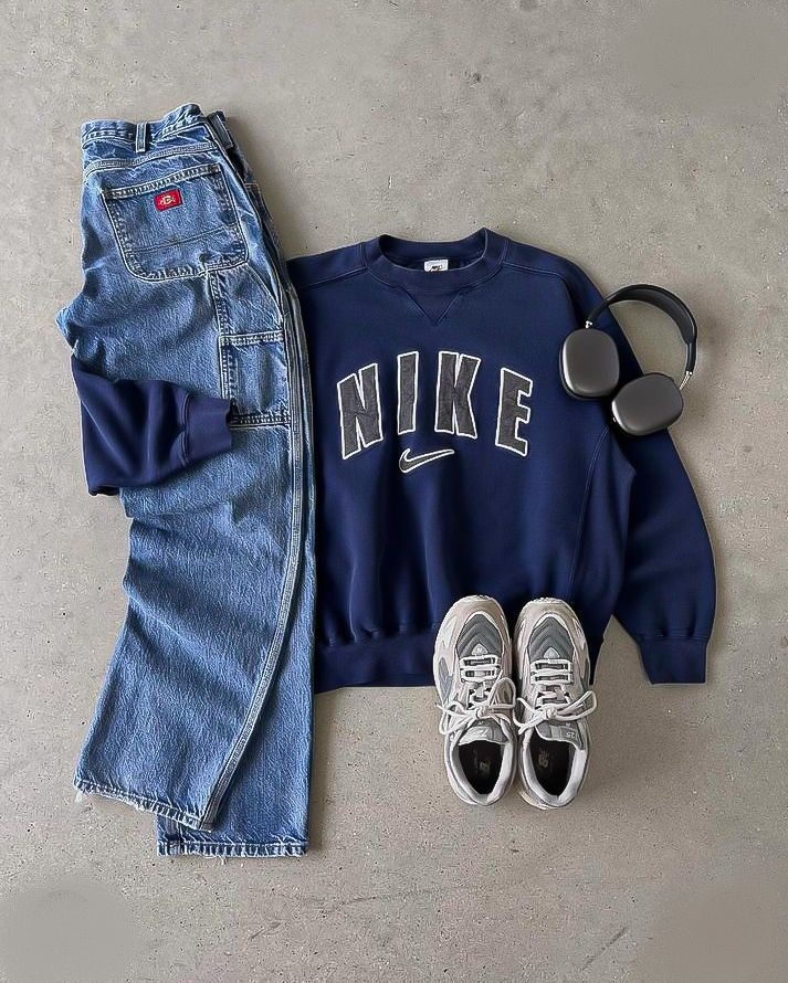 Nike vintage navy crewneck with Dickies carpenter jeans and New Balance sneakers